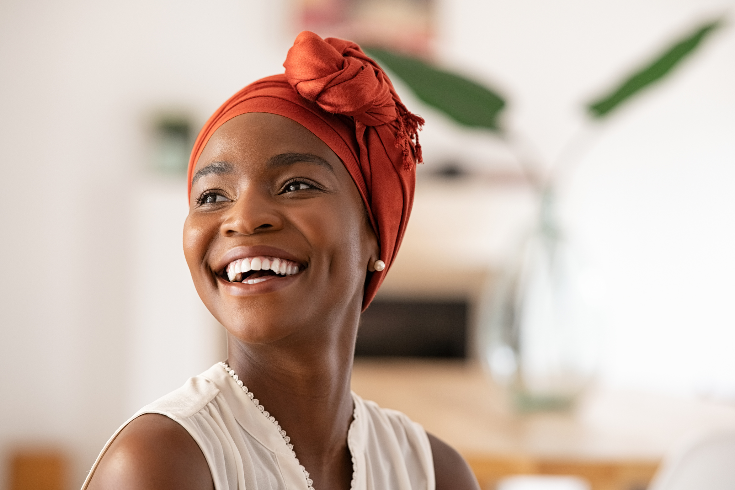 Joyful Mature Woman Laughing and Looking Away