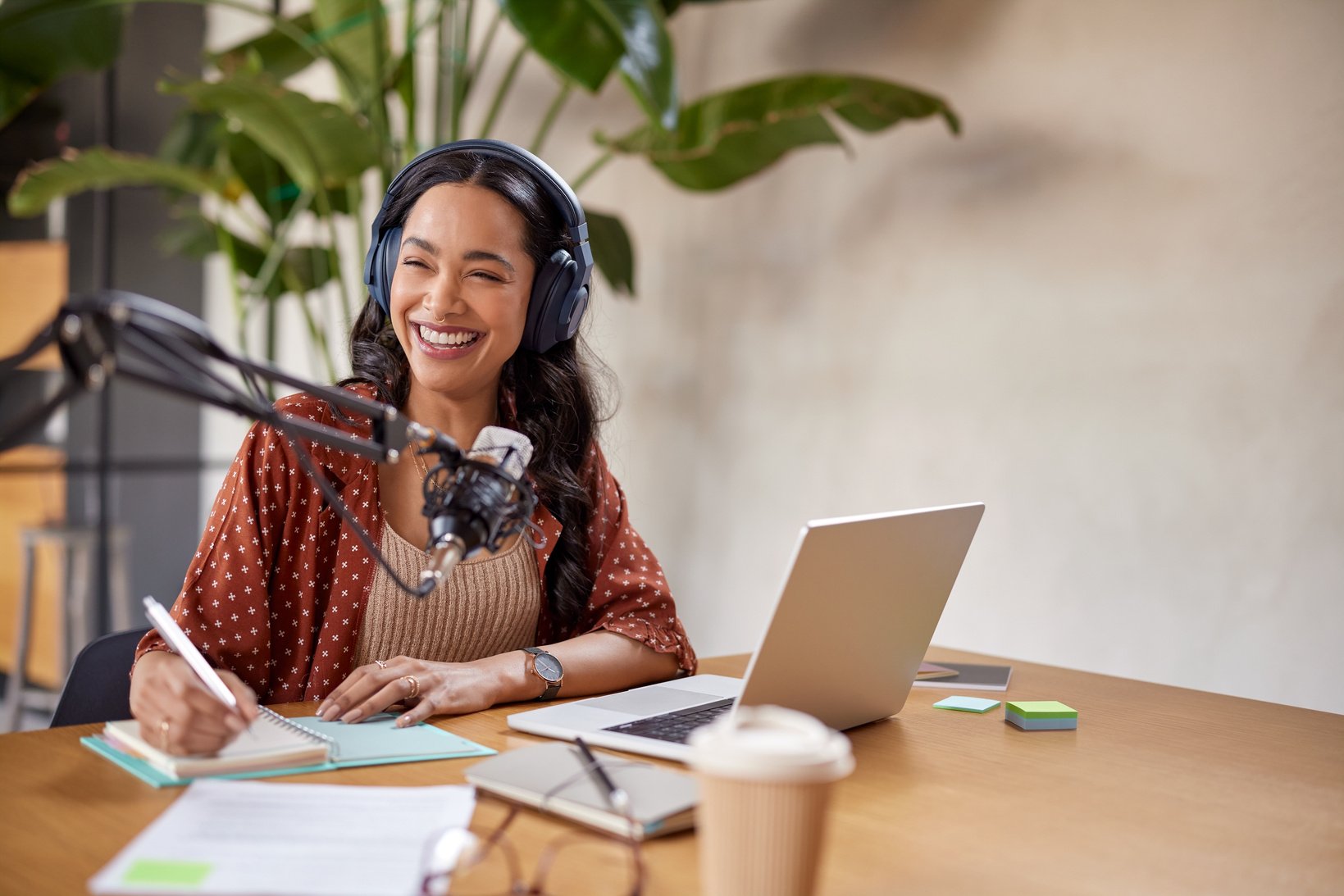 Happy smiling woman speaking on web radio